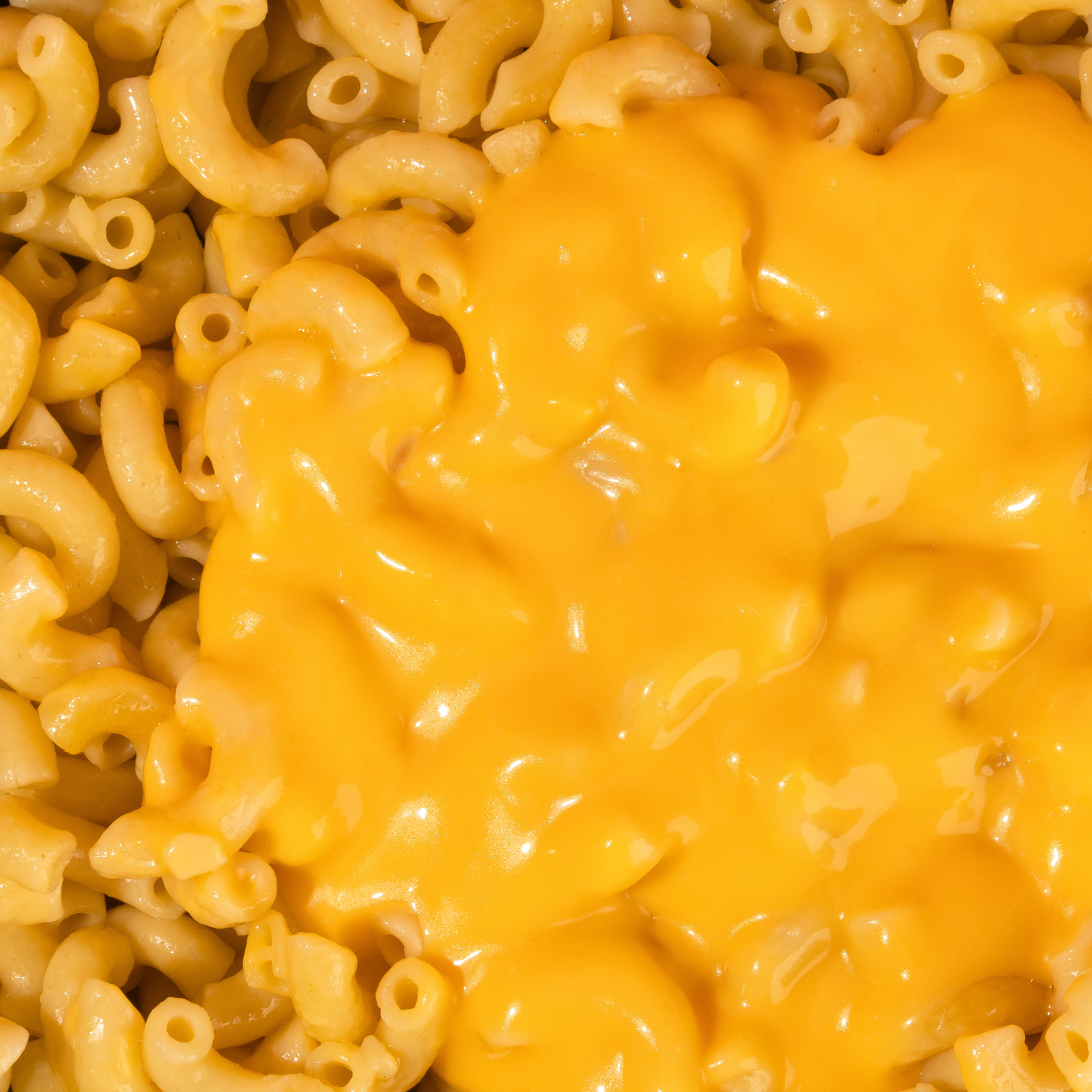 Macaroni and cheese with a close-up view of the pasta and cheese sauce.